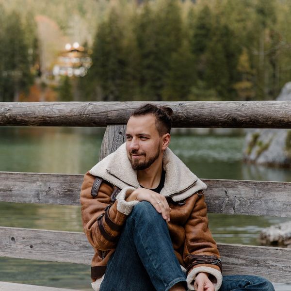 Person in a calm pose with a serene natural background.